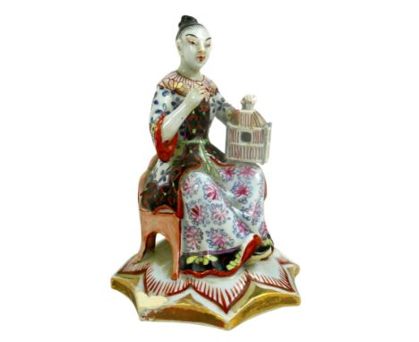 A group of four porcelain Oriental figurines; a Hochst style Chinese lady carrying her wares, with cartwheel mark to base '37