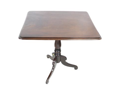 A George III mahogany tilt top side table, on a turned column and tripod base, 64 by 50 by 69cm high.