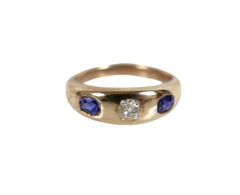 A yellow gold diamond and sapphire three stone ring, surface tests to approximately 14ct, height 5.6mm, size K, 4.7g.