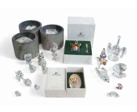 A collection of eleven Swarovski ornaments, of different sizes, some boxed, together with six similar glass ornaments. (11)