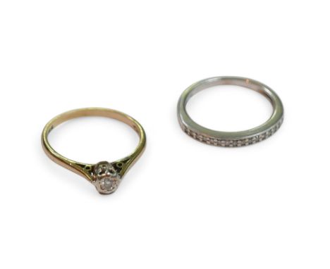 Two 9ct gold and diamond rings, one a solitaire, size L, the other a half eternity ring, size K. (2)