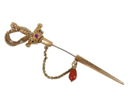 An Italian 18K yellow gold pin brooch, formed as a sword with basket hilt, set with gemstones, steel 'blade', a coral bead su