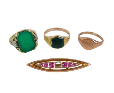 Three gold rings and a brooch comprising a 9ct signet ring, a 14ct ring, a gilt metal signet ring(surface tests to 9ct) and a