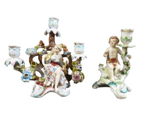 A figurative candelabra and a Derby candlestick. both 24cm high. AF. [2]