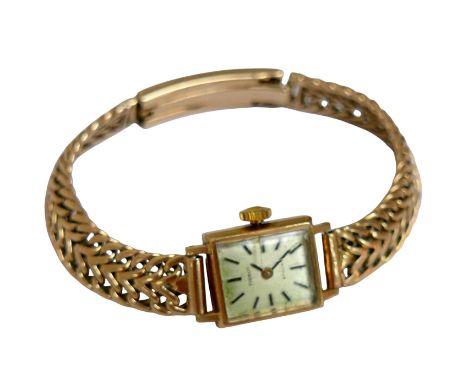 A 9ct gold Tissot lady's wristwatch, with 9ct gold case and bracelet, golden baton hour markers, 17 jewel movement, 23.6g gro