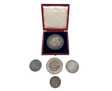 A group of five silver coins and medals, comprising a silver commemorative medallion coin for Queen Victoria 1897 Diamond Jub
