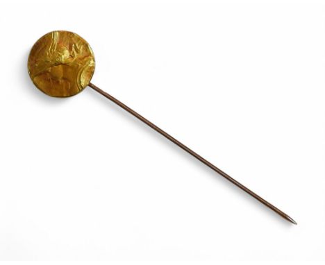 A continental gold and yellow metal stick pin, with gold pin bearing rubbed small hallmarks, yellow metal disc with a profile