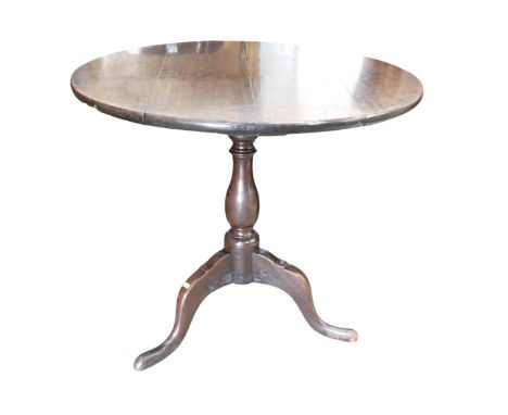 A George III mahogany side table, with a bird cage action on  turned column and tripod base, 83 by 75cm high.
