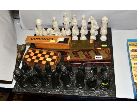 A MODERN RESIN CHESS SET, with medieval style chess men, together with cribbage boards, dominoes and miniature chess set (6)
