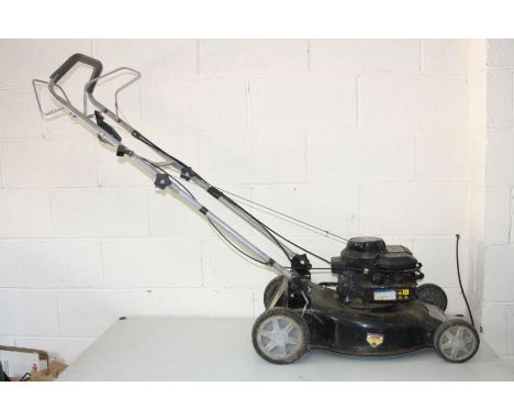 A LAWN KING PETROL LAWN MOWER with a Briggs and Stratton 450 series 148cc engine and 18'' blade and grass box (engine pulls f