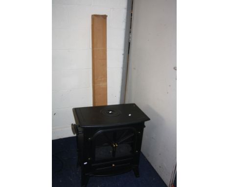 A POUNDSTRETCHER LARGE STOVE HEATER, 1850w (PAT pass and working), a boxed cast metal facial pack and a vintage projector scr