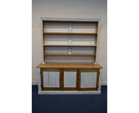 A VICTORIAN HALF PAINTED PINE DRESSER, with a triple tier plate rack and a base with triple panel doors, width 188cm x depth 