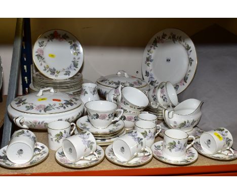 A ROYAL WORCESTER 'JUNE GARLAND' PATTERN PART DINNER SERVICE, comprising two tureens and covers, an oval meat plate, sauce bo