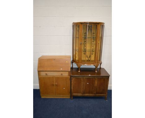 A MID 20TH CENTURY OAK FALL FRONT BUREAU, an oak blanket chest, walnut china cabinet, oak cased Singer sewing machine and a w