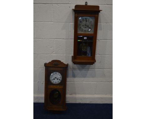 A FRENCH WALNUT WALL CLOCK, with Westminster chime, together with an early to mid 20th Century oak wall clock, with later pai