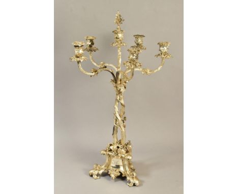 A VICTORIAN ELKINGTON PLATE SIX LIGHT CANDELABRUM, cast with fruiting vine on a entwined trunk stem, the triangular base engr