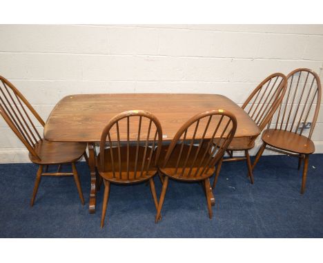 AN ERCOL GOLDEN DAWN ELM REFECTORY TABLE, width 153cm x depth 85cm x height 73cm and five high spindle hoop back chairs (s.d.