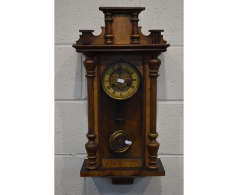 A LATE 19TH CENTURY WALNUT VIENNA WALL CLOCK (missing finials) (winding key, pendulum)