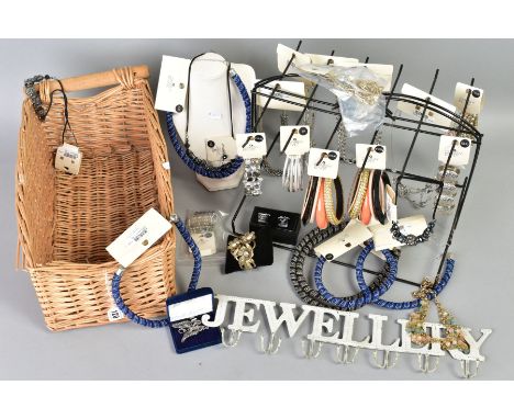 A BASKET AND DISPLAY STAND OF COSTUME JEWELLERY, the wicker basket includes items such as a display bust, beaded necklaces, a