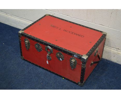 A VINTAGE RED GROUND TRAVELLING TRUNK, and a circular tin (2)&nbsp; Condition Report&nbsp; Wooden with leatherette wrapping