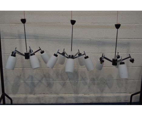 A SET OF THREE 1970'S MODERNIST ITALIAN STYLE FIVE BRANCH CEILING LIGHTS, with a chrome frame and shaped glass shades, diamet