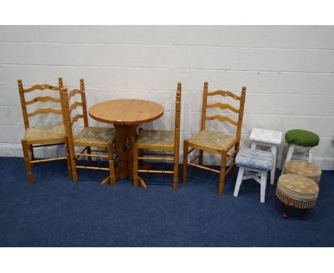 A MODERN PINE CIRCULAR KITCHEN TABLE, and four rush seated ladder back chairs (one chair with s.d.), together with three pain