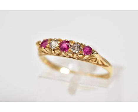 AN EARLY 20TH CENTURY 18CT GOLD RUBY AND DIAMOND RING, designed with three circular cut rubies interspaced with oldcut diamon