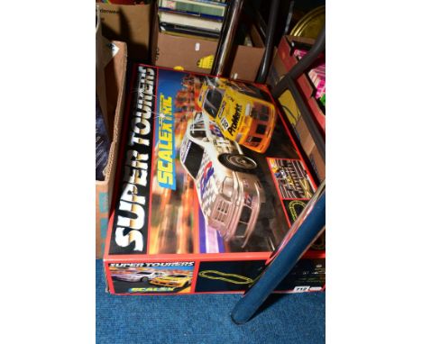 A BOXED SCALEXTRIC SUPER TOURERS RACING SET, No.C1000, appears complete with both cars, track, hand controllers and transform