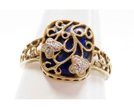 A 9ct gold lapis lazuli and diamond ring, in a floral wire work cushion setting, size R/S, 3.0g. 