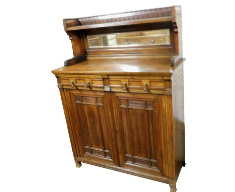 A Victorian Gothic oak and mahogany chiffonier, with a galleried mirror back, with single shelf, over two cushion drawers, ab
