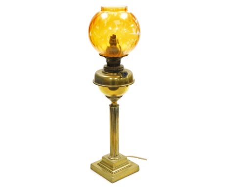 A Young's brass oil lamp, converted to electricity, of fluted column form, raised on a stepped square base, with inside hand 