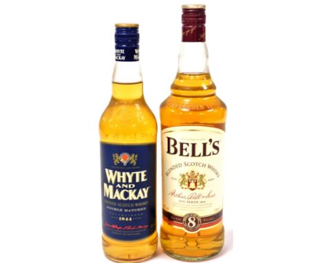 A bottle of Whyte and Mackay double matured smooth Scotch Whisky, and a bottle of Bells Blended Scotch Whisky, aged eight yea