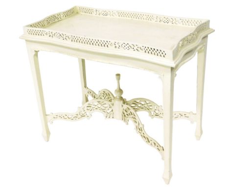 A Chinese Chippendale style white painted serpentine silver table, with a fret work gallery, raised on channel square legs un