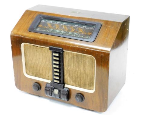 A mid 20thC HMV 1117 wooden cased radio, with long, medium and short waves, 49cm wide. Buyer Note: WARNING! This lot contains