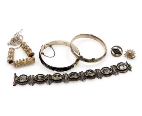 Silver jewellery, comprising an Egyptian niello and filigree bracelet, two single earrings, far eastern silver and niello ban