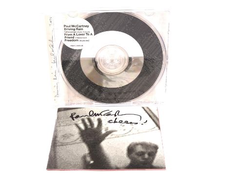 Paul McCartney autograph - Driving Rain CD signed to front of booklet / cover 'Paul McCartney cheers!'. Vendor worked at a ma