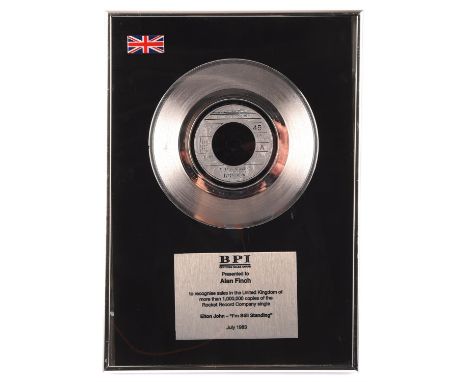 Elton John I'm Still Standing BPI Platinum disc - presented to Alan Finch to recognise sales of more than 1,000,000 copies of
