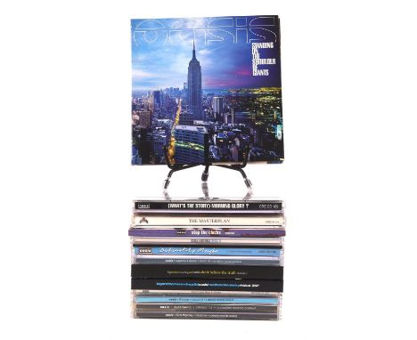 Oasis and related CDs including Noel Gallagher autograph - to include, copy of What's The Story Morning Glory CD signed to th