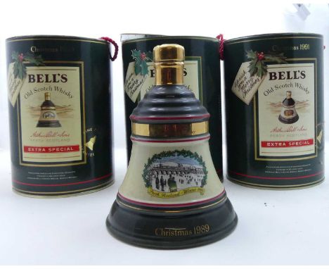 A collection of Bells commemorative Scotch Whisky decanters, to include various Christmas editions, the birth of Princess Bea