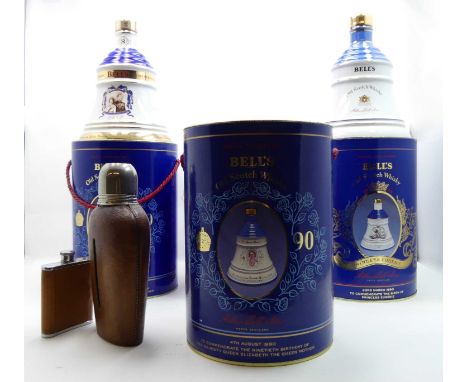 Four various boxed commemorative Bells Old Scotch Whisky decanters, to include three Aged 8 Year examples, together with a gl
