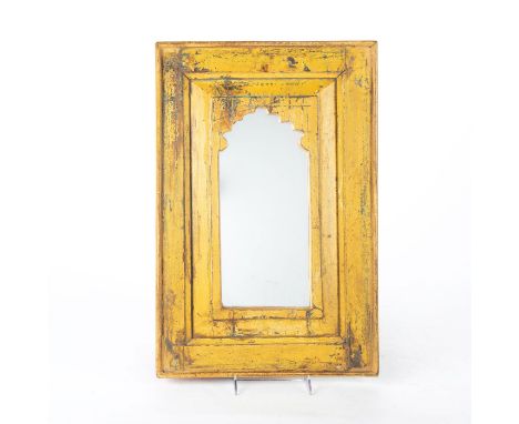 A central arabesque design with exquisite antique patina.A hand carved and decorated wooden Jharokha window frame in traditio
