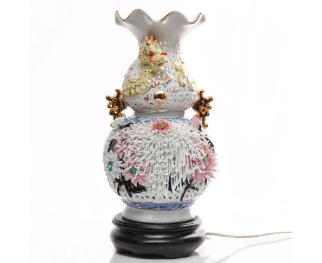 Porcelain, white with cut out designs, applied dï¿½cor, gilded.With applied dragon and floral dï¿½cor. Electrical wiring for 