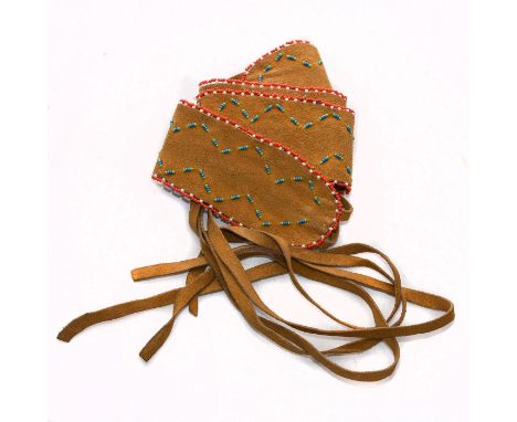 Hand made with beads, Native geometric tribal designs throughout.A Native American Navajo Hopi Indian handmade soft leather b
