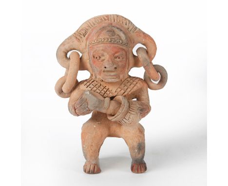 Tribal figure holding vessel and tool.Figure with large openings on sides of head with 2 rings in each opening. Restoration t