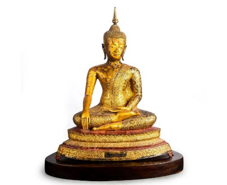 A devotional statue, with a profusion of hand applied gold leaf decoration.Presented on a custom wooden base stand. Removable