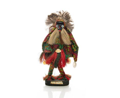 Tribal festival wooden doll with Guro mask and Cloak. Issued: 1950 c. Dimensions: 12""H Provenance: David Farin Collection 