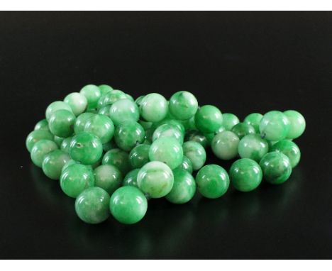 A jade bead necklace, comprising seventy-four uniform spherical jadeite beads, each bead approximately 1.5-2cm, overall lengt