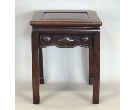 A Chinese rosewood low occasional table, first half 20th century, with recessed square form single panel top contained within