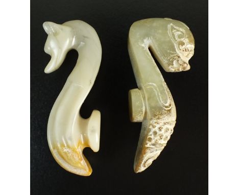 A Chinese mutton fat jade belt hook, 20th century, carved in the form of a fox, 6.5cm in length, and another example with fu 