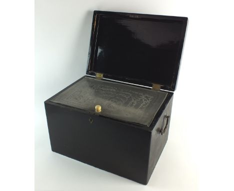 A Chinese black lacquered tea caddy, Qing dynasty, 19th century, of rectangular form with brass swing handles to either side,